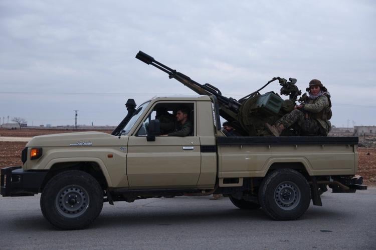 Syrian government forces enter northern towns after Kurdish fighters withdraw