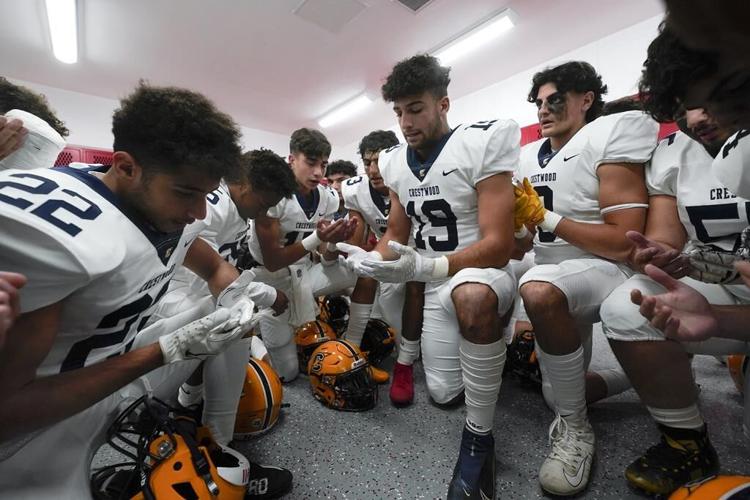 Prayers go on, sometimes out of sight, in prep football