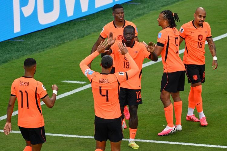 Brian Brobbey and the Dutch roll in the rain to a 3-1 win over Tunisia to top World Cup Group F