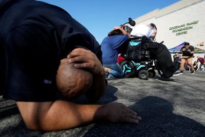 Residents of earthquake zones 'drop, cover and hold on' during annual ShakeOut quake drill