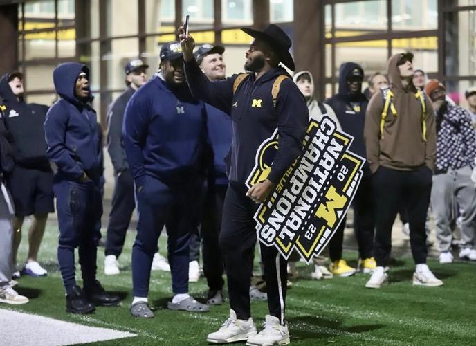 Michigan Wolverines return home to screaming fans after victory over Washington Huskies