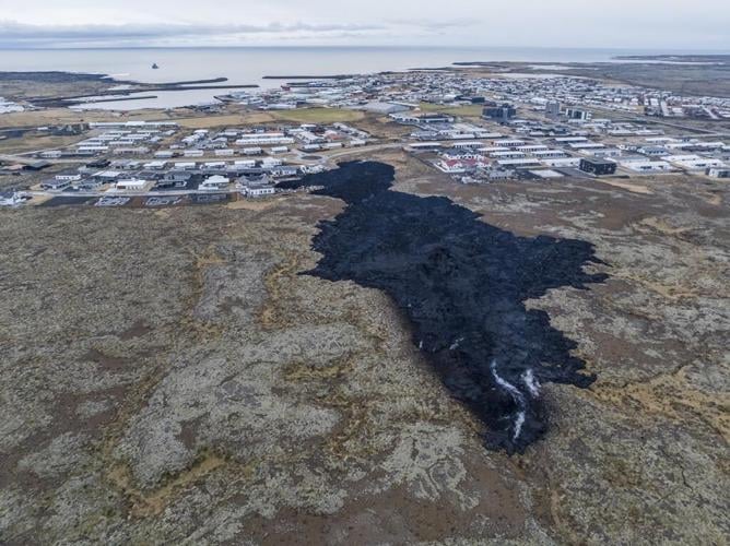 Iceland faces daunting period after lava from volcano destroys homes in fishing town, president says
