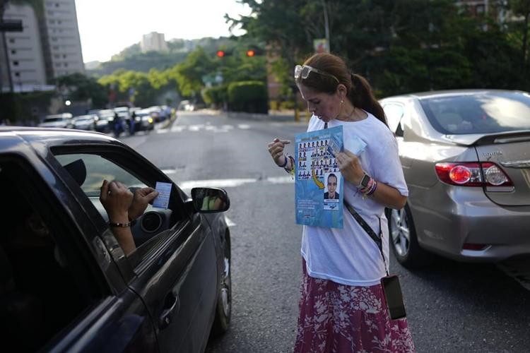 Venezuelan opposition voters band to safeguard election, warning of the ruling party's tricks