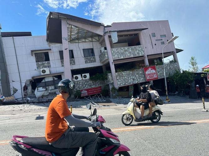 A 7.8 magnitude quake in the Philippines kills at least 19, fells buildings and sets off a tsunami