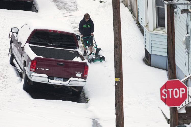 Winter's first big snowstorm hits the Northeast as schools close and traffic slows