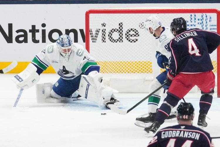 Blue Jackets beat skidding Canucks 4-1 behind Marchenko and Johnson