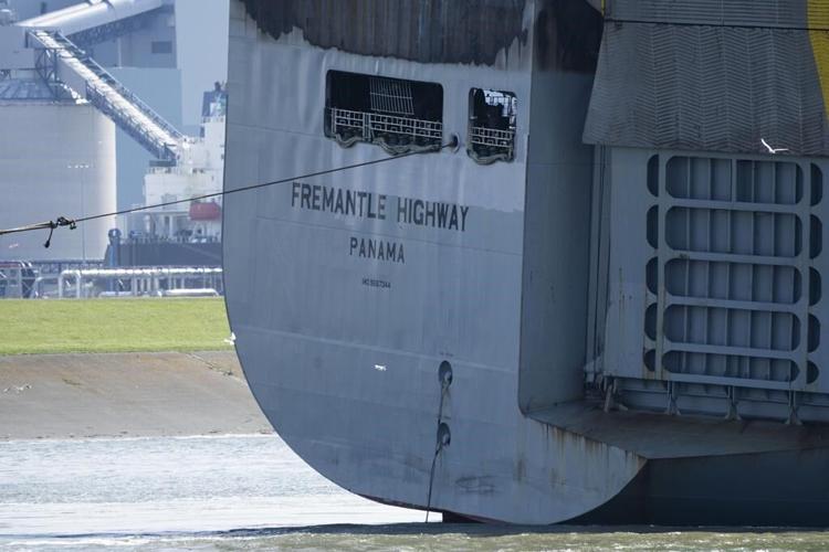 A car-carrying ship that burned for a week on the North Sea is towed to a Dutch port for salvaging