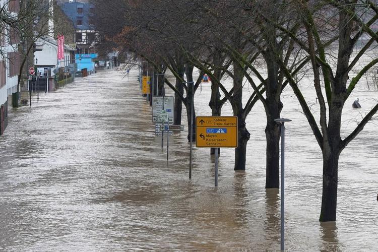 Extreme cold leaves thousands without power in Nordic countries while floods again hit Germany