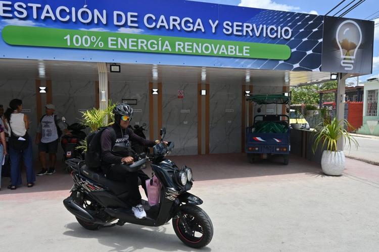 A solar-powered charging station in central Cuba brings life to a darkened island