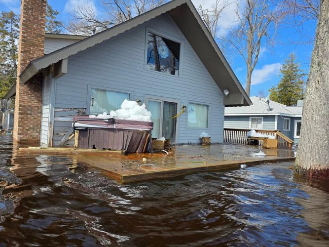 Heavy rain and snowmelt are hurtling large chunks of ice into northeastern Michigan homes