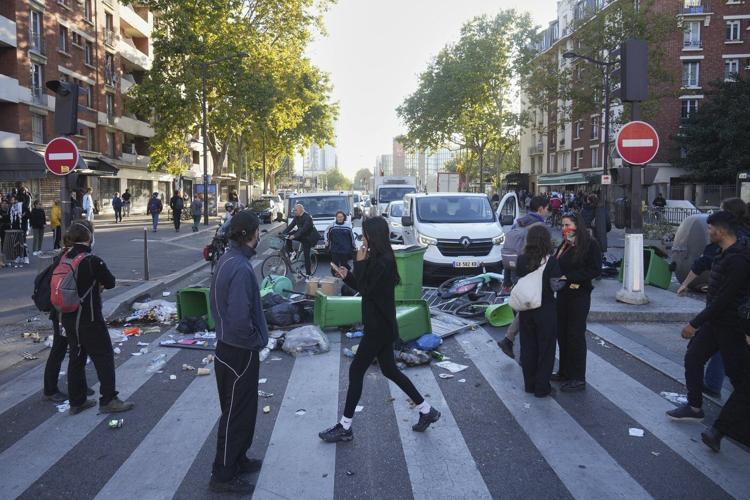 Protesters block roads and start fires across France to challenge the new prime minister, in photos
