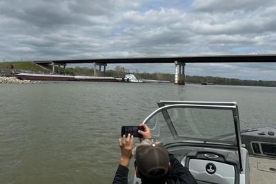 Oklahoma State Patrol says it is diverting traffic after a barge hit a bridge