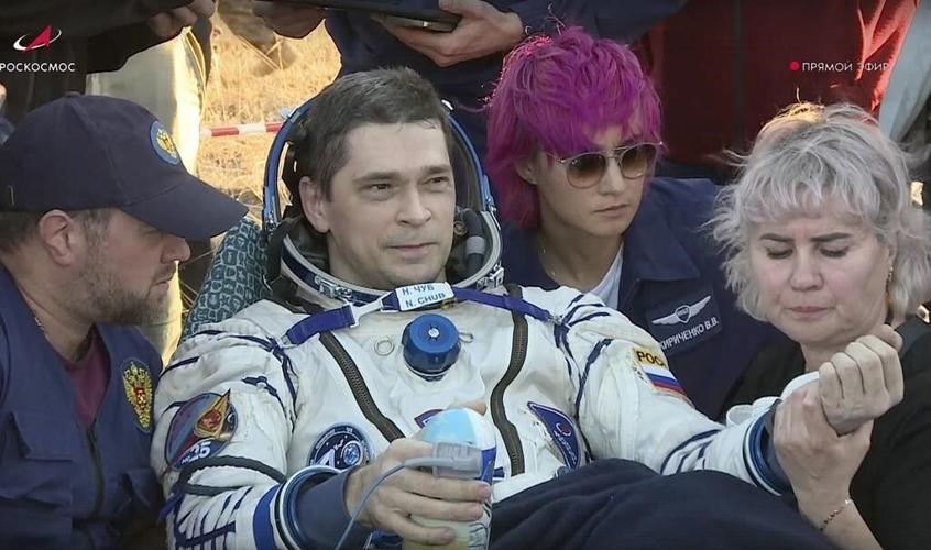 A Soyuz capsule with 2 Russians and 1 American from the International Space Station returns to Earth