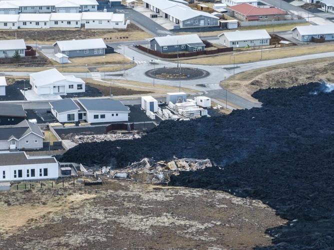 President says Iceland faces daunting period after lava from volcano destroys homes in fishing town