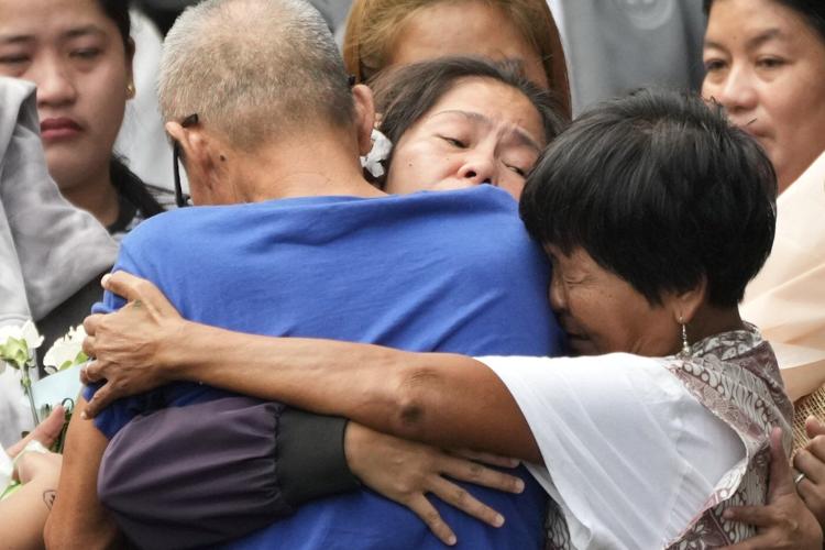 Filipina who won a last-minute reprieve from an Indonesian firing squad returns home