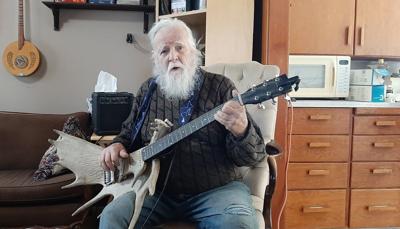 Music maker, 88, creates unique horn section, with moose antler bass guitar and cello