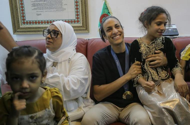 Gold medal boxer Imane Khelif hailed upon return to Algeria
