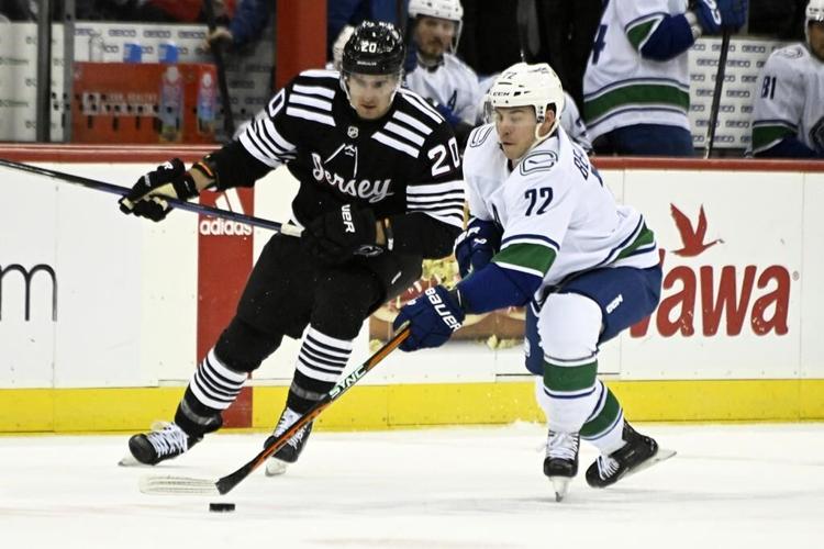 Bratt power-play OT goal gives Devils 5-4 win over Canucks