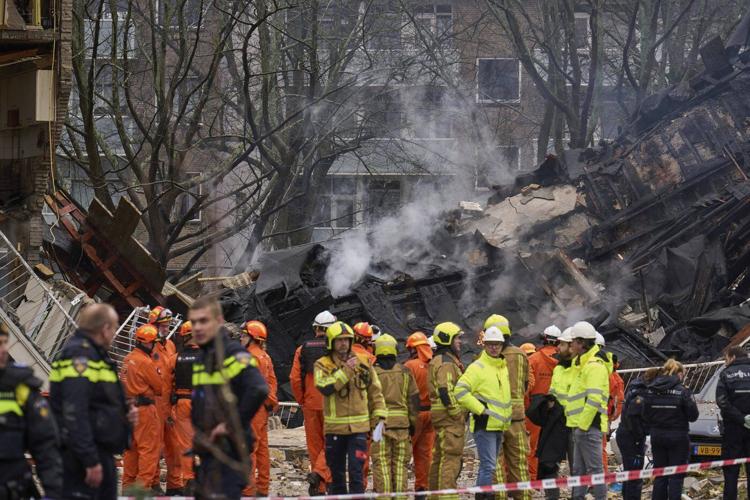 Rescuers search for victims after an explosion at a Dutch apartment block that killed at least 5