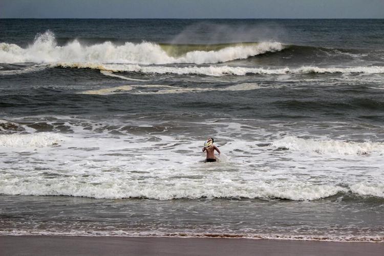 India evacuates hundreds of thousands of people and shuts schools as a tropical storm nears