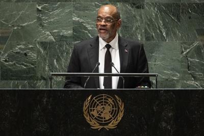 Gunfire paralyzes Haiti as powerful gang leader says he will try to detain police chief, ministers