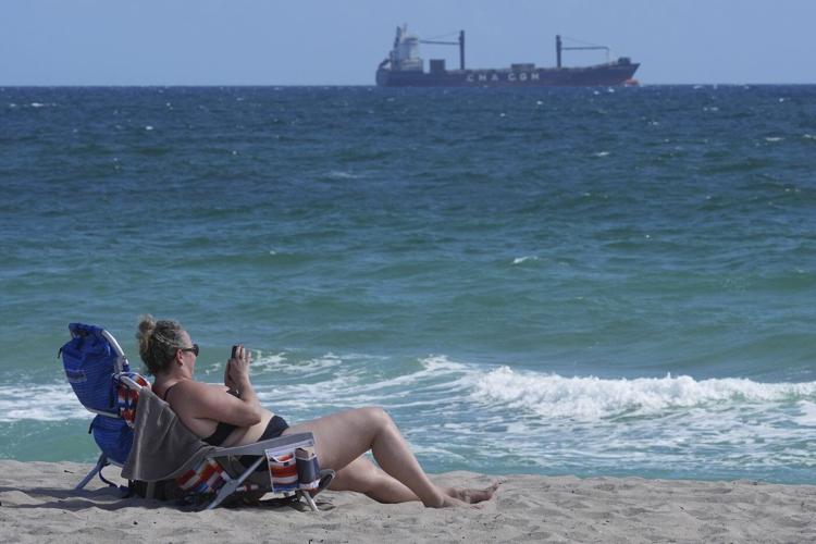 Tar balls wash ashore on Florida beaches, but the source of the sticky black goo is a mystery