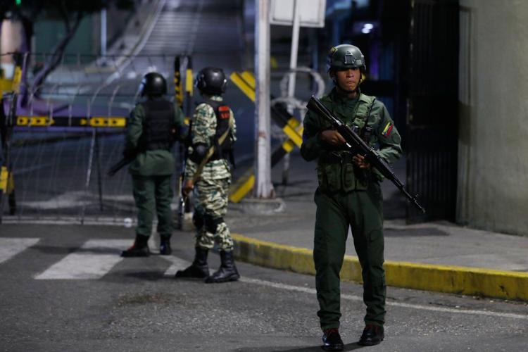 Photos show residents evacuating after explosions in Caracas, Venezuela