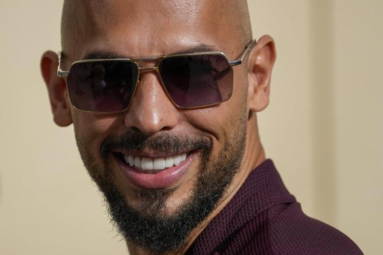 Influencer Tate brothers, who face human trafficking charges in Romania, arrive in the US