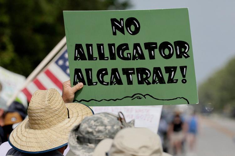 Detained immigrants at 'Alligator Alcatraz' say there are worms in food and wastewater on the floor
