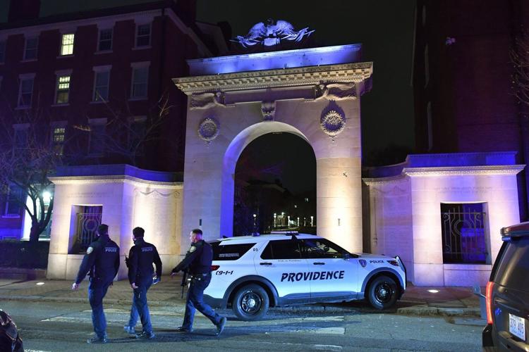 Photos show police investigation of a shooting at Brown University.
