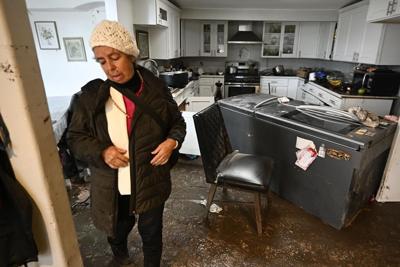 San Diegans cry, hug outside damaged homes after stunning flash floods in normally balmy city