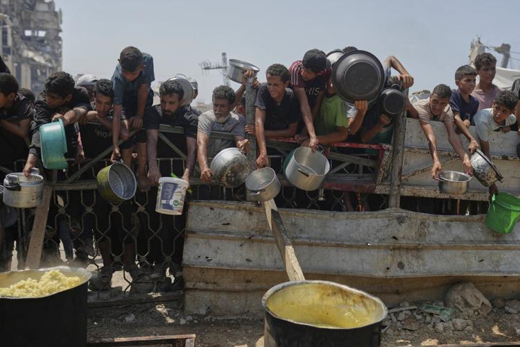 Baby girl killed with parents in Gaza airstrike as Israelis urge a mass protest over the war