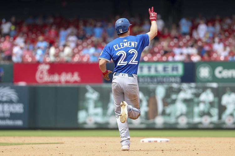 Blue Jays third baseman Clement leaves game after banging knee diving for a grounder
