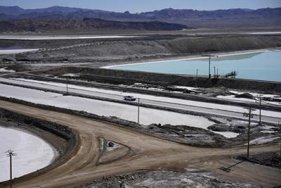 Threatened by shortages, electric car makers race for supplies of lithium for batteries