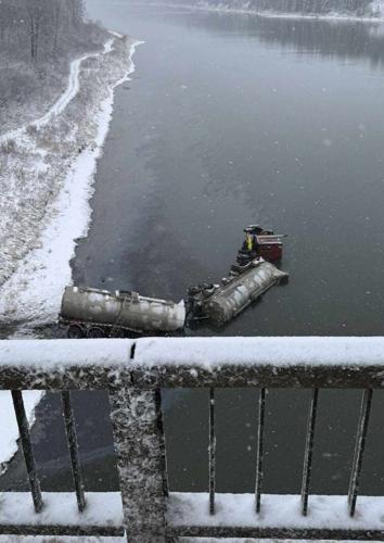 Bitumen believed to be in river after tanker truck loses control on Alberta road