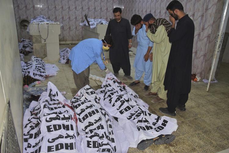 A suicide bombing near a political rally in southwestern Pakistan kills 13 and wounds 30