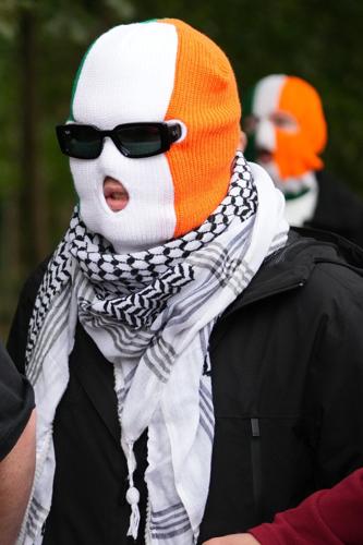 A British court throws out terror-related charge against Irish-language hip-hop group Kneecap member