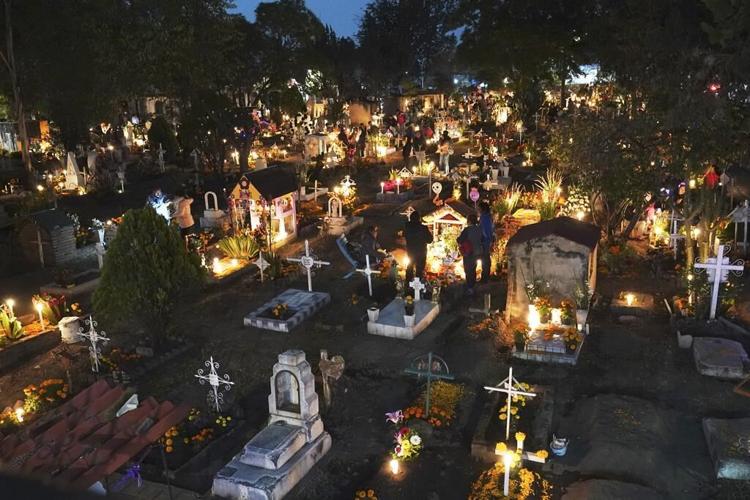 With flowers, altars and candles, Mexicans are honoring deceased relatives on the Day of the Dead
