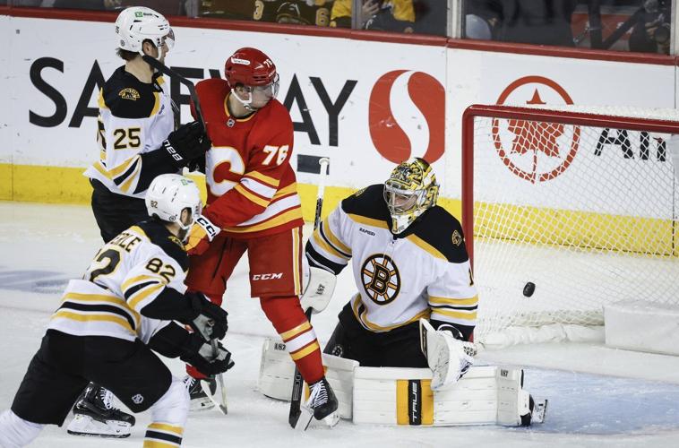 Pastrnak scores in OT as Bruins rally to beat Flames 4-3