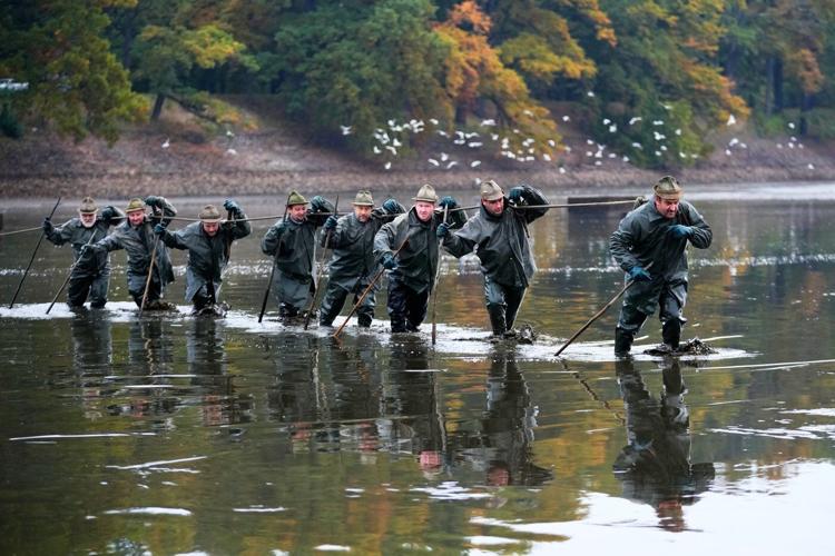 Photos show Czech fisherman hauling in Christmas carp for holiday tables