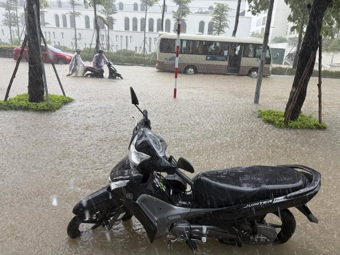 Heavy rain falls in parts of Southeast Asia after tropical storm blows into Vietnam
