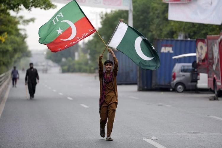 Pakistani police besiege Imran Khan's home as deadline for him to hand over suspects is to expire