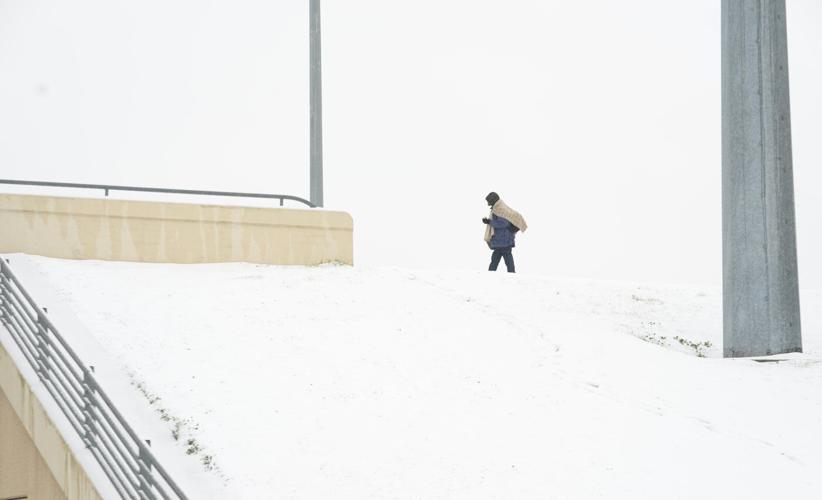 Winter storm plods into the Deep South, prompting states of emergency and school closures
