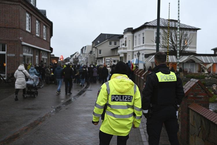 German island festival passes peacefully after criticism over practice of men hitting women