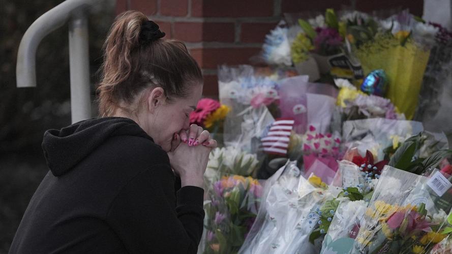 Prosecutor says officer killed in gunman's Pennsylvania hospital siege was hit by police fire