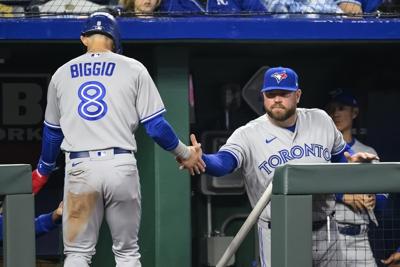 Singer, Lopez lead Royals past Blue Jays 9-5 for 1st win