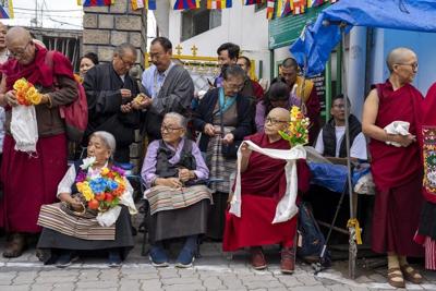 Dalai Lama returns to Indian headquarters after knee replacement surgery in the US