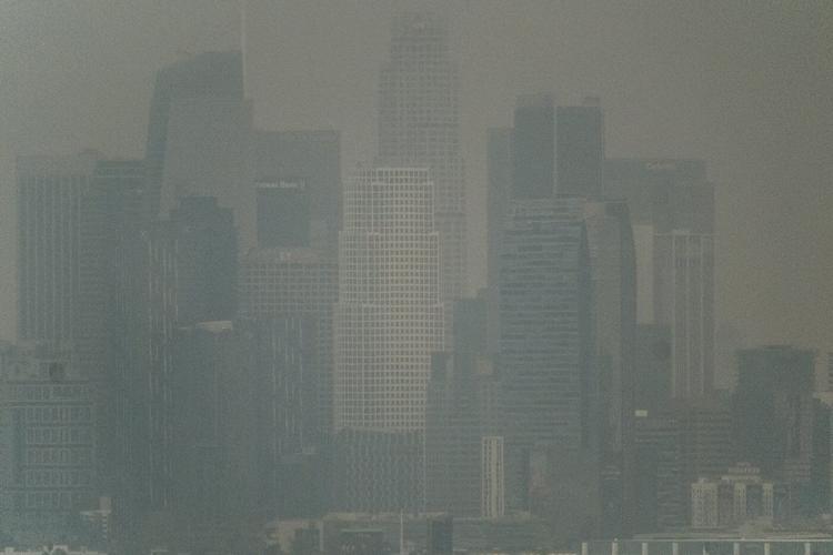 Far from wildfire flames, residents of sunny Los Angeles go about their lives in disquiet and fear