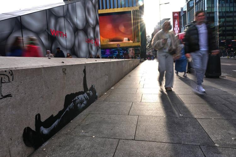 Banksy unveils new art in London following speculation over murals depicting stargazing figures