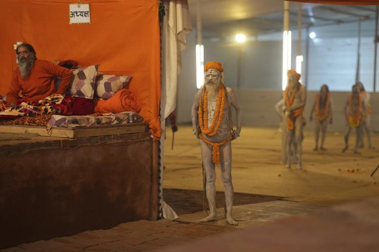 Naked, ash-smeared Hindu ascetics take holy dips at the Maha Kumbh festival